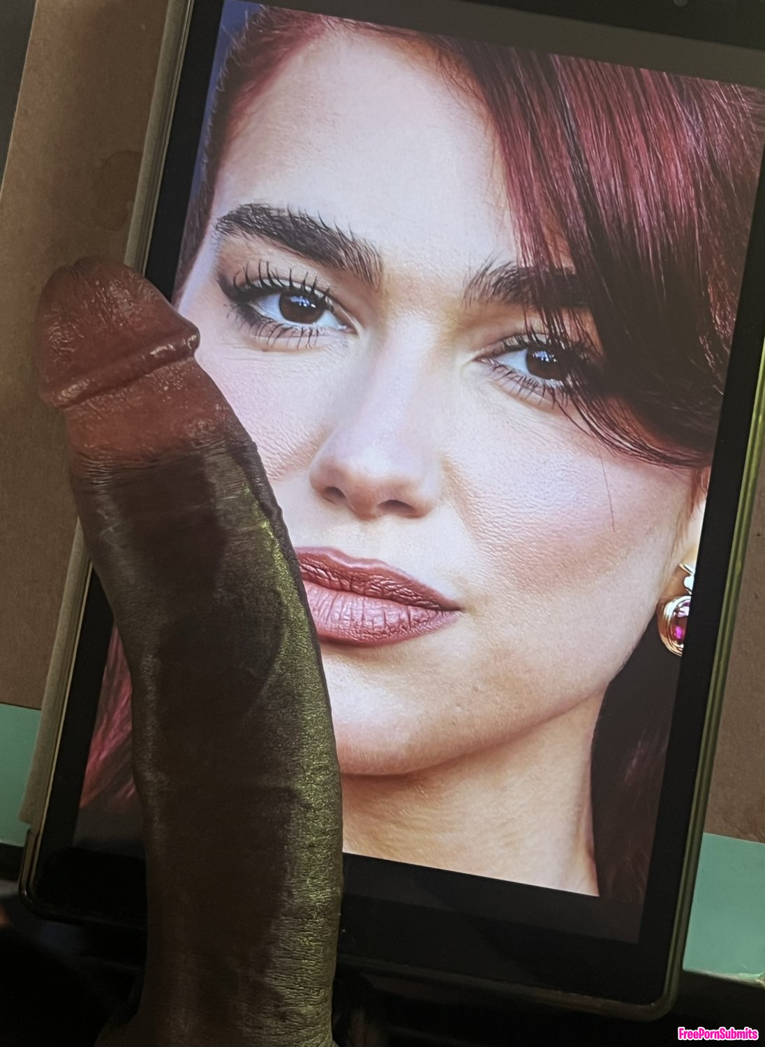 Dua Lipa BBC photo featuring cock tribute