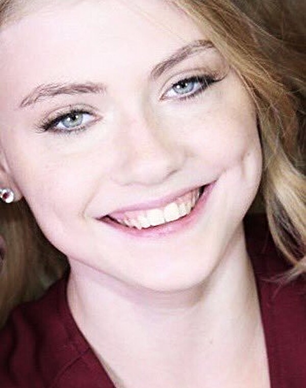 Thumbnail for She looks like she's smiling for her yearbook profile but then you zoom out...